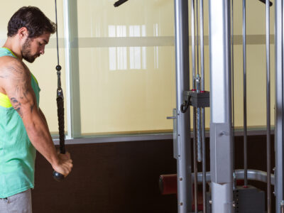 Triceps pressdown high pulley workout man at gym exercise